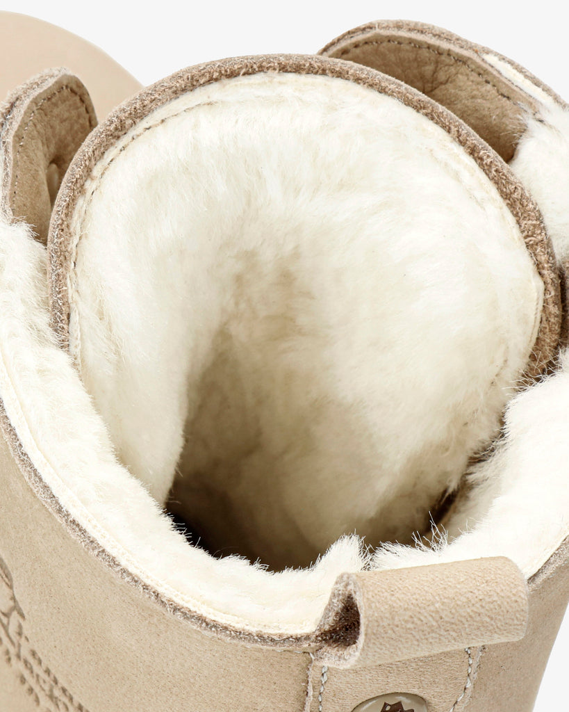 Fara Igloo Trav botas de piel con forro interior de pelo natural. crudo