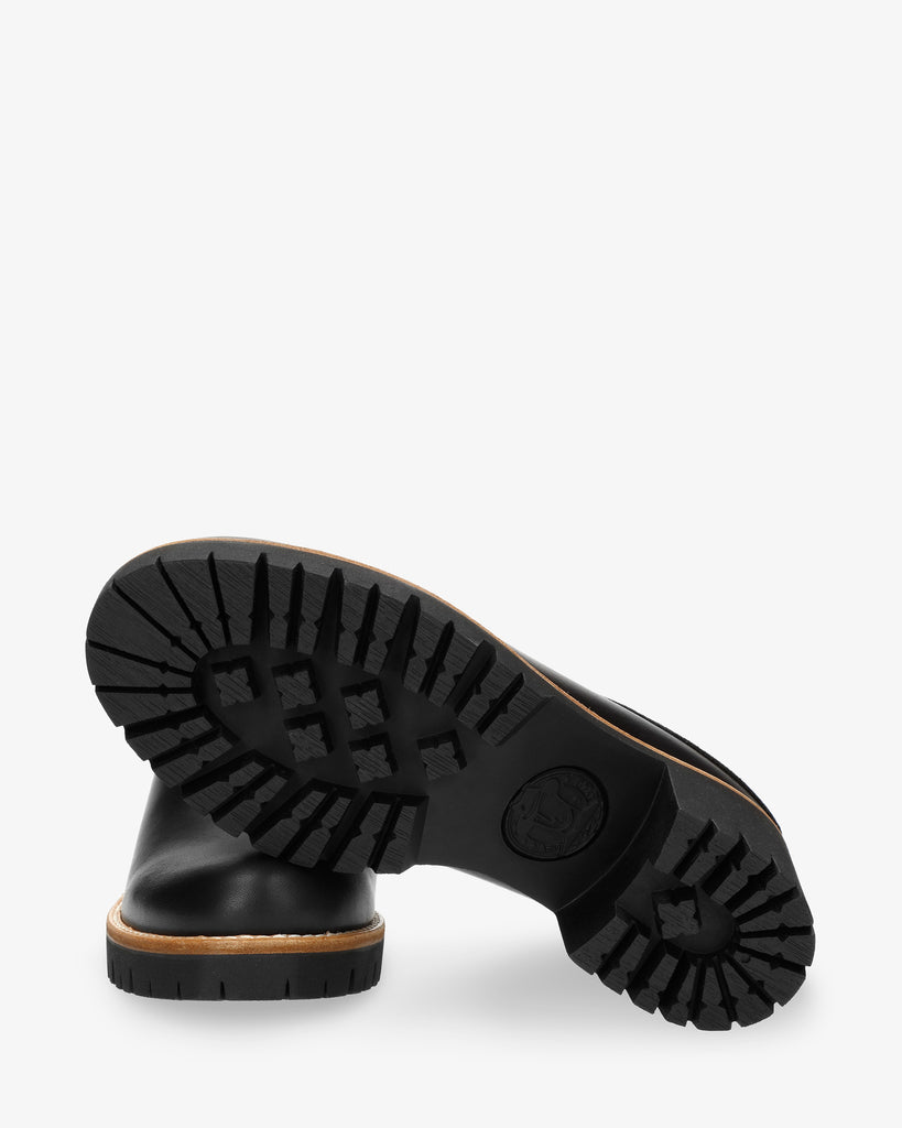 Priana Igloo zueco de piel con forro interior de pelo natural. negro